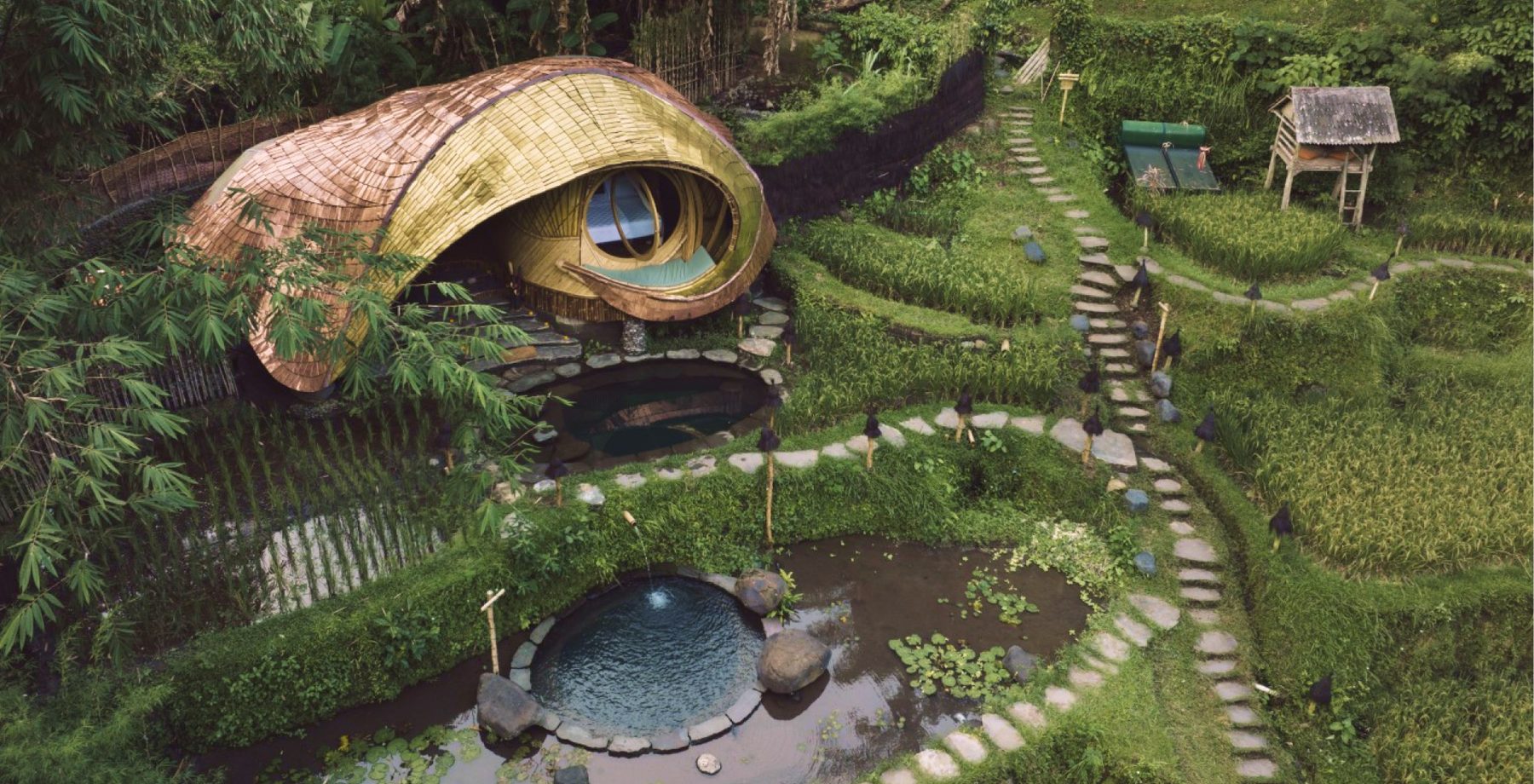 New Moon House, a curved bamboo house beside the water gardens